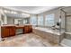 Large bathroom with tub, shower, tile floors, and double sinks at 10646 Amesbury Way, Highlands Ranch, CO 80126