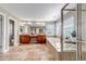 Spacious primary bathroom with tile flooring, double vanity, soaker tub, and glass-enclosed shower at 10646 Amesbury Way, Highlands Ranch, CO 80126