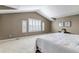 Bright bedroom with carpet, vaulted ceilings, and window at 10646 Amesbury Way, Highlands Ranch, CO 80126