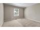 Neutral bedroom with wall-to-wall carpet and a window with blind offering bright light at 10646 Amesbury Way, Highlands Ranch, CO 80126