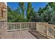 Outdoor deck with wood flooring and railing, offering ample space for entertaining and relaxation at 10646 Amesbury Way, Highlands Ranch, CO 80126