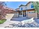 Inviting home featuring a multi-car garage, stone accents, and an open house banner in the driveway at 10646 Amesbury Way, Highlands Ranch, CO 80126