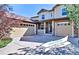 Charming two-story home featuring a three-car garage and well-maintained landscaping at 10646 Amesbury Way, Highlands Ranch, CO 80126