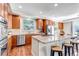 Kitchen featuring stainless steel appliances, granite countertops, island and wood cabinets at 10646 Amesbury Way, Highlands Ranch, CO 80126