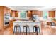 Spacious kitchen featuring a large island, stainless steel appliances, and wood cabinetry at 10646 Amesbury Way, Highlands Ranch, CO 80126