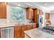 Close up of the kitchen with granite countertops, stainless steel appliances and wood cabinets at 10646 Amesbury Way, Highlands Ranch, CO 80126
