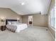 Spacious main bedroom with neutral carpet, ensuite access, and plenty of natural light at 10646 Amesbury Way, Highlands Ranch, CO 80126