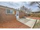 Brick home backyard featuring a concrete patio and fenced-in yard space at 1537 Xenia St, Denver, CO 80220