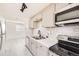 Modern kitchen featuring stainless steel appliances, new countertops, and a stylish tile backsplash at 1537 Xenia St, Denver, CO 80220