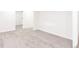 Finished basement area with neutral carpeting, white walls, and easy access to adjacent rooms at 5261 Chandler Way, Denver, CO 80239