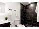 Modern bathroom with a tiled shower, sleek fixtures and an integrated sink and vanity at 5261 Chandler Way, Denver, CO 80239