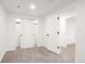 Finished bedroom showcasing neutral carpet and light walls with access to closet and door at 5261 Chandler Way, Denver, CO 80239