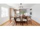 Elegant dining area with a large wooden table and hardwood floors at 2809 Forest St, Denver, CO 80207