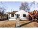 Charming remodeled home with a white brick exterior, landscaping, and a walkway at 2809 Forest St, Denver, CO 80207