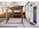 Brick patio with pergola and built-in seating at 2809 Forest St, Denver, CO 80207