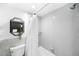 Clean bathroom with shower/tub combo and gray tile at 3100 E Cherry Creek South Dr # 903, Denver, CO 80209