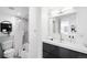 Bright bathroom with gray tile, vanity, and shower at 3100 E Cherry Creek South Dr # 903, Denver, CO 80209