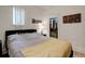 Bedroom features natural light, crown molding, and closet at 737 La Farge Ave, Louisville, CO 80027