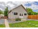 Charming exterior featuring well-maintained lawn and fencing at 737 La Farge Ave, Louisville, CO 80027