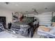 Spacious garage featuring a parked vehicle and storage racks at 737 La Farge Ave, Louisville, CO 80027
