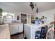 Bright kitchen features white cabinets, a butcher block countertop, and a stainless steel refrigerator at 737 La Farge Ave, Louisville, CO 80027