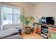 Living room with large window and entertainment center at 737 La Farge Ave, Louisville, CO 80027