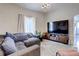 Spacious living room featuring a large television and cozy seating at 737 La Farge Ave, Louisville, CO 80027