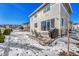 Spacious backyard with patio, grill, and snowy ground at 1886 Makley Loop, Castle Rock, CO 80104
