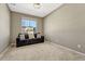Bright bedroom featuring a large window and comfortable sofa at 1886 Makley Loop, Castle Rock, CO 80104