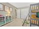 Bedroom view featuring a bunk bed, closet doors, and organized shelving with colorful storage bins at 1886 Makley Loop, Castle Rock, CO 80104