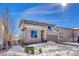 Two-story house with stone accents and snowy front yard at 1886 Makley Loop, Castle Rock, CO 80104