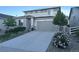 Two-story house with stone accents and landscaped yard at 1886 Makley Loop, Castle Rock, CO 80104