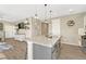 Spacious kitchen with a large island, stainless steel appliances, and seamless flow to the living area at 1886 Makley Loop, Castle Rock, CO 80104