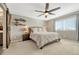 Serene main bedroom with a cozy bed, natural light from the window, and stylish floating shelves at 1886 Makley Loop, Castle Rock, CO 80104