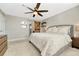 Tranquil main bedroom features a cozy bed, accent barn door, and stylish floating shelves with decor at 1886 Makley Loop, Castle Rock, CO 80104