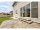 The backyard patio has a beautiful tiled concrete and a large sliding glass door at 1886 Makley Loop, Castle Rock, CO 80104