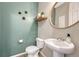 Stylish powder room with modern fixtures and decorative accents at 1886 Makley Loop, Castle Rock, CO 80104