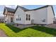 Exterior view highlighting the pristine lawn and modern architecture at 1425 Burt Ave, Berthoud, CO 80513