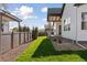 Beautifully landscaped backyard featuring lush green grass and gravel for low maintenance at 1425 Burt Ave, Berthoud, CO 80513