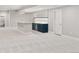 Finished basement with a wet bar, mini fridge, and door for privacy at 1425 Burt Ave, Berthoud, CO 80513