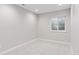 Bright basement bedroom with a window allowing ample natural light and fresh air at 1425 Burt Ave, Berthoud, CO 80513