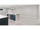 Finished basement features a wet bar with pendant lighting and a carpeted floor at 1425 Burt Ave, Berthoud, CO 80513