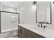 Modern bathroom features a glass shower and a vanity with elegant countertops at 1425 Burt Ave, Berthoud, CO 80513