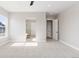 Bedroom featuring neutral colors, plush carpet, and an ensuite bathroom at 1425 Burt Ave, Berthoud, CO 80513