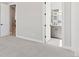 Bright bedroom with plush carpeting, neutral paint, and en-suite bathroom, designed for relaxation and comfort at 1425 Burt Ave, Berthoud, CO 80513