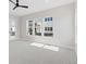 Bright bedroom with a ceiling fan and a view from the large windows at 1425 Burt Ave, Berthoud, CO 80513