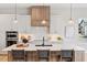 Modern kitchen featuring a large island with seating, custom cabinetry, and stainless appliances at 1425 Burt Ave, Berthoud, CO 80513