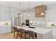 Bright kitchen features stainless appliances, a large center island, and custom cabinets at 1425 Burt Ave, Berthoud, CO 80513