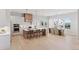 Spacious kitchen with a large island, stainless steel appliances, and a dining area at 1425 Burt Ave, Berthoud, CO 80513