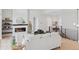 Bright and airy living room with a modern fireplace and open staircase at 1425 Burt Ave, Berthoud, CO 80513